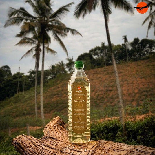 Nilgiri Marten wood-pressed coconut oil bottle among coconut palms in Kuttiyadi, north Kerala